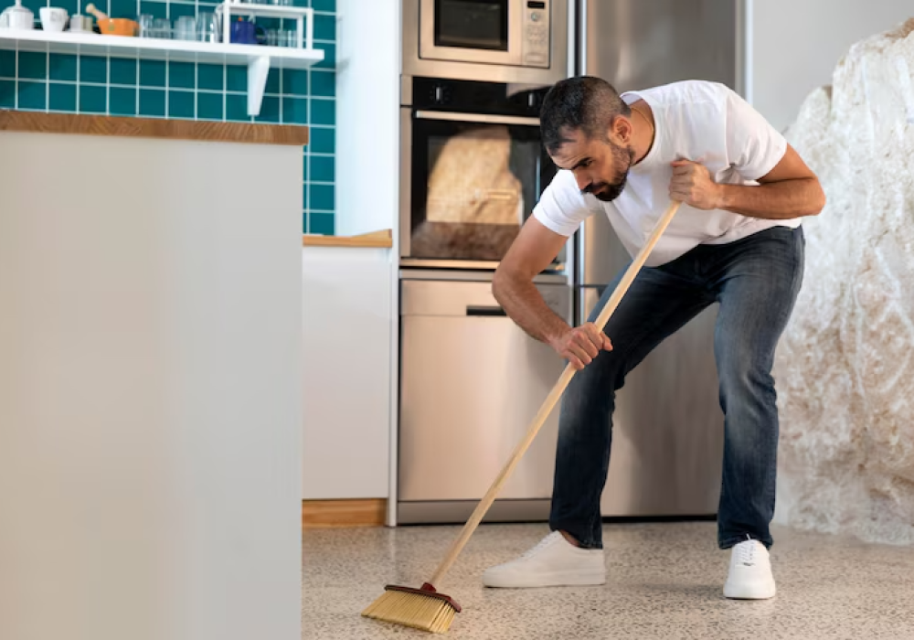 full-shot-man-cleaning-kitchen_23-2148931342